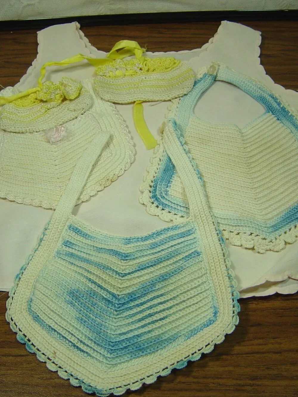 Lot of 5 vintage baby items-3 crocheted bibs, 1 pair of booties & 1 pink slip